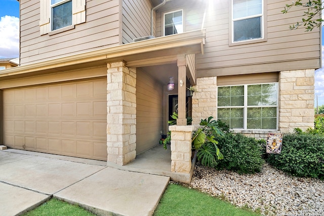 doorway to property featuring a garage