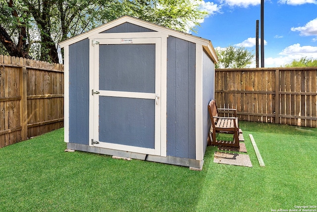 view of outdoor structure featuring a lawn