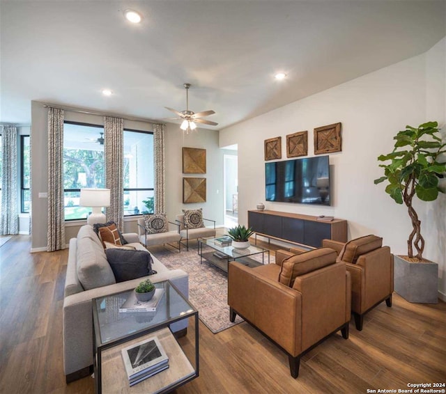 living room featuring ceiling fan and wood-type flooring