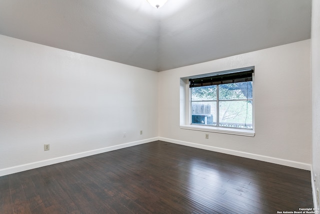 unfurnished room featuring dark hardwood / wood-style floors