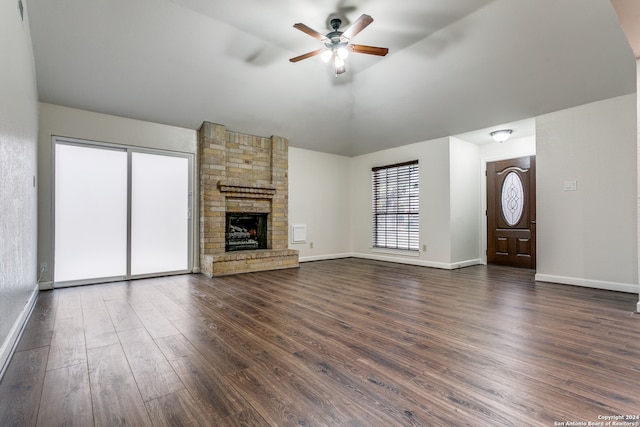 unfurnished living room with dark wood-type flooring, ceiling fan, and a fireplace