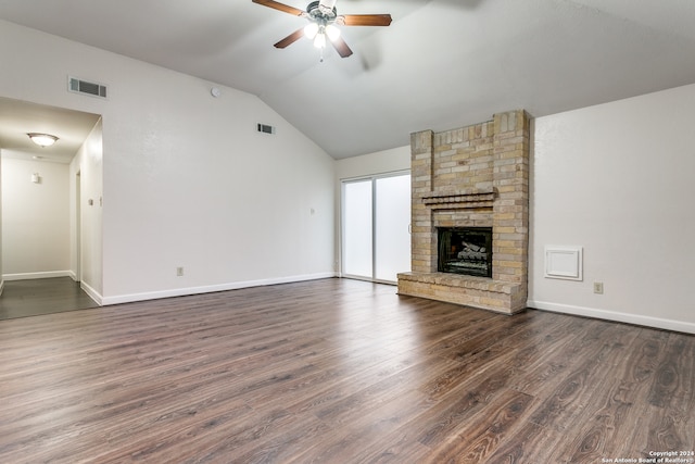 unfurnished living room featuring ceiling fan, lofted ceiling, dark hardwood / wood-style floors, and a fireplace