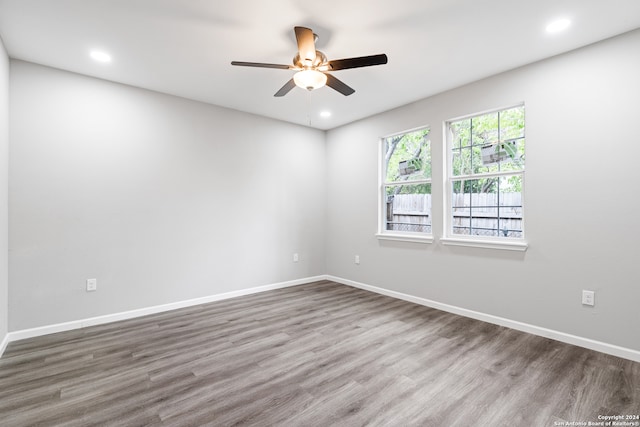 empty room featuring hardwood / wood-style floors and ceiling fan