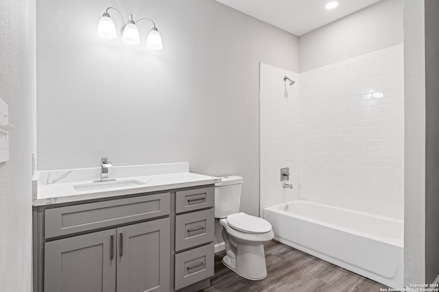 full bathroom featuring toilet, vanity, shower / bath combination, and hardwood / wood-style flooring