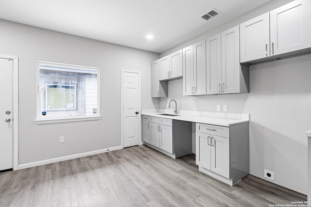 kitchen featuring sink and light hardwood / wood-style flooring