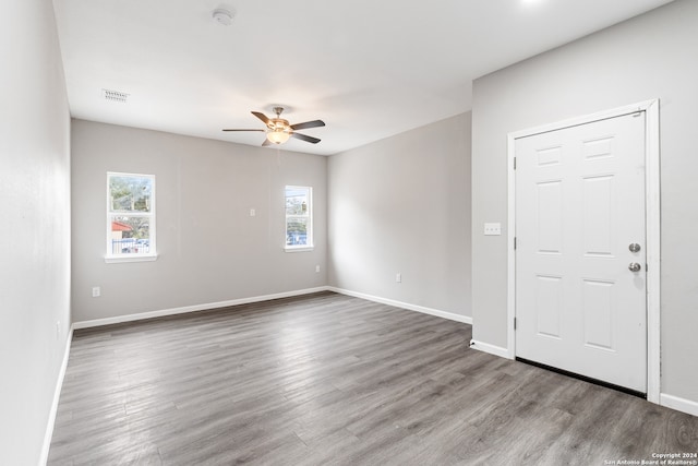 empty room featuring hardwood / wood-style flooring and ceiling fan