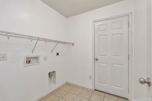 laundry room featuring washer hookup, hookup for a gas dryer, light tile patterned flooring, and hookup for an electric dryer