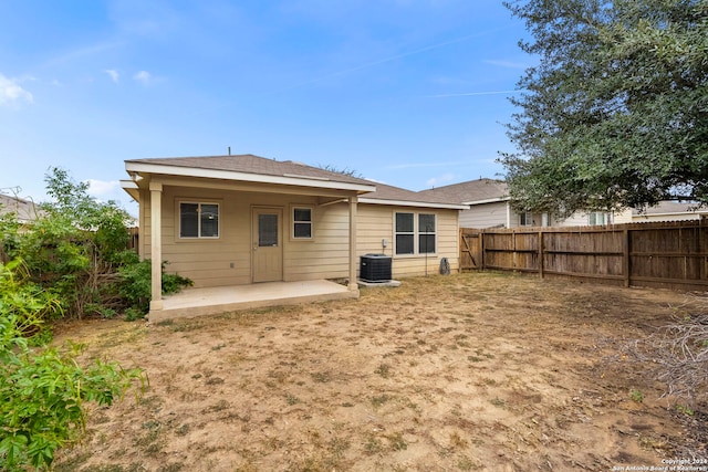 rear view of house featuring central AC and a patio