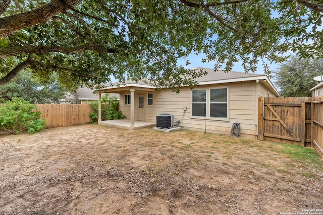 rear view of house featuring a patio and central air condition unit