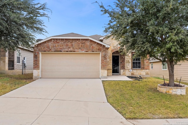 view of front of house with a garage and a front yard