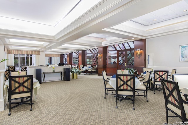 dining area with ornamental molding and light carpet