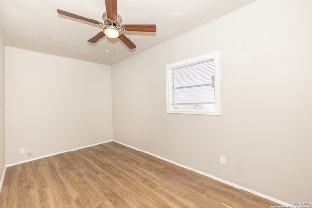 unfurnished room with hardwood / wood-style floors and ceiling fan