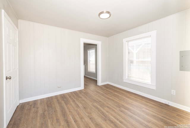 unfurnished room with hardwood / wood-style flooring