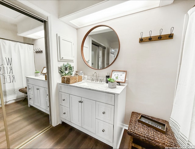 bathroom featuring wood-type flooring and vanity