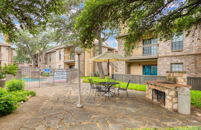 view of patio featuring fence