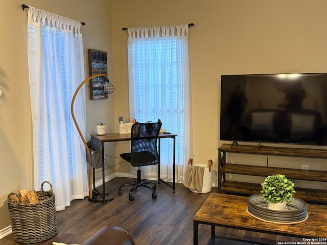 office area featuring dark wood-style flooring and baseboards
