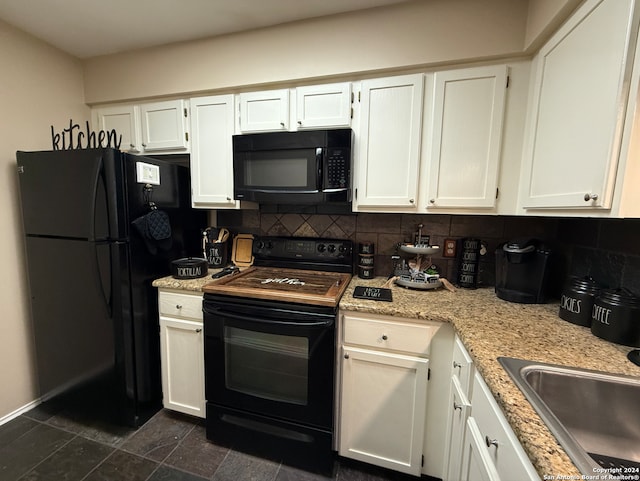 kitchen featuring black appliances, a sink, white cabinetry, tasteful backsplash, and light stone countertops