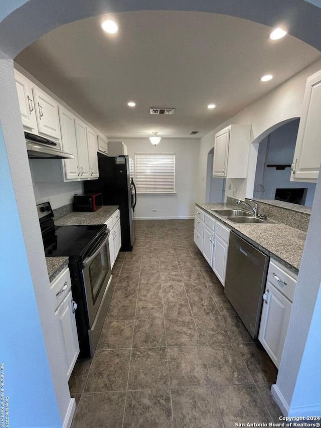 kitchen with white cabinetry, sink, and appliances with stainless steel finishes