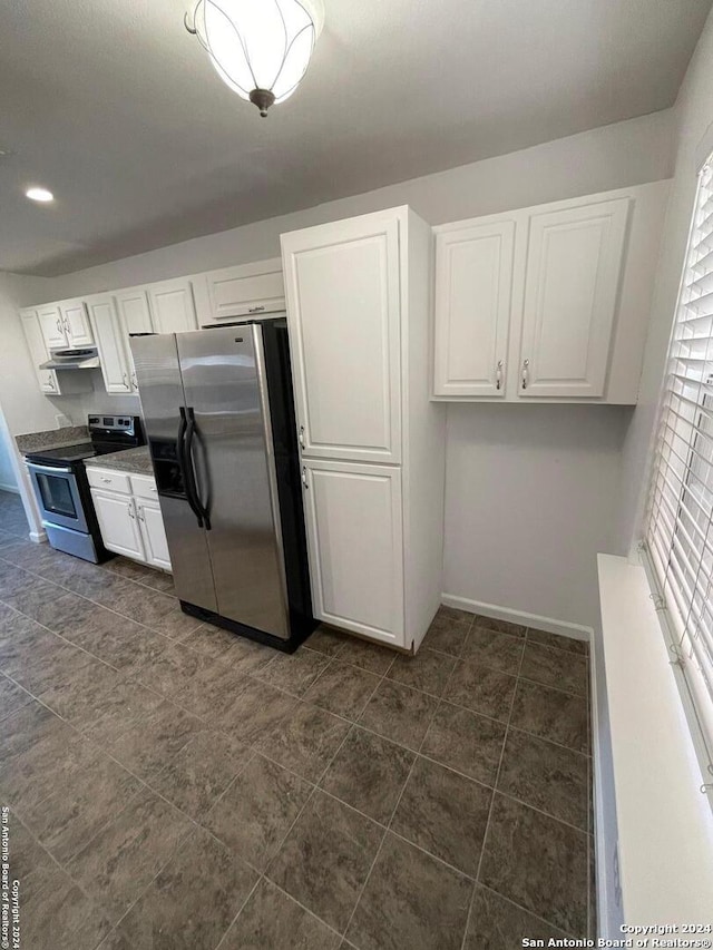 kitchen with white cabinets and appliances with stainless steel finishes