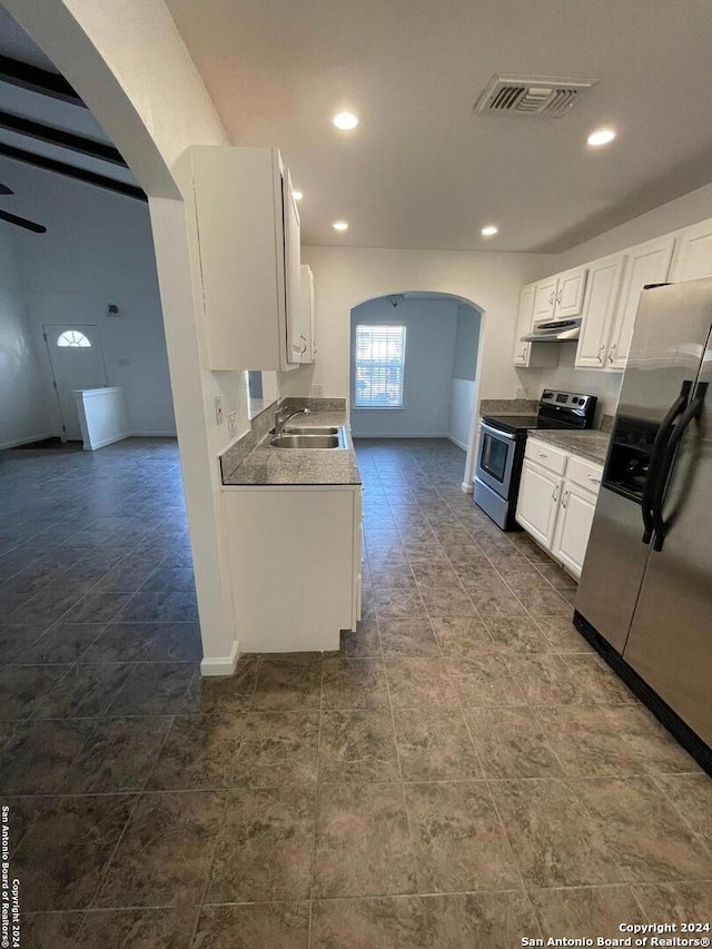 kitchen featuring white cabinets, sink, and appliances with stainless steel finishes