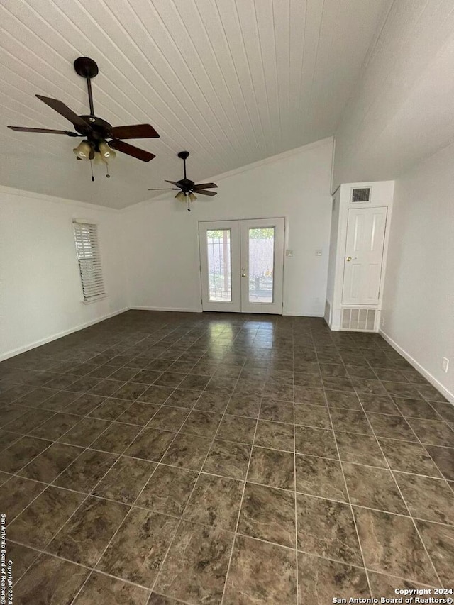 unfurnished living room with wooden ceiling, ceiling fan, vaulted ceiling, and dark tile patterned flooring