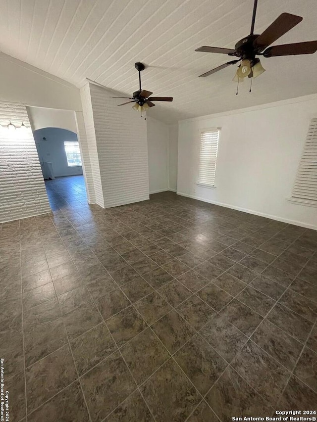 unfurnished room with ceiling fan, vaulted ceiling, and wooden ceiling