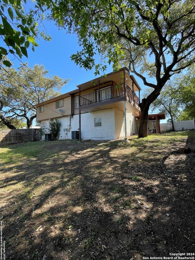 back of property with central air condition unit