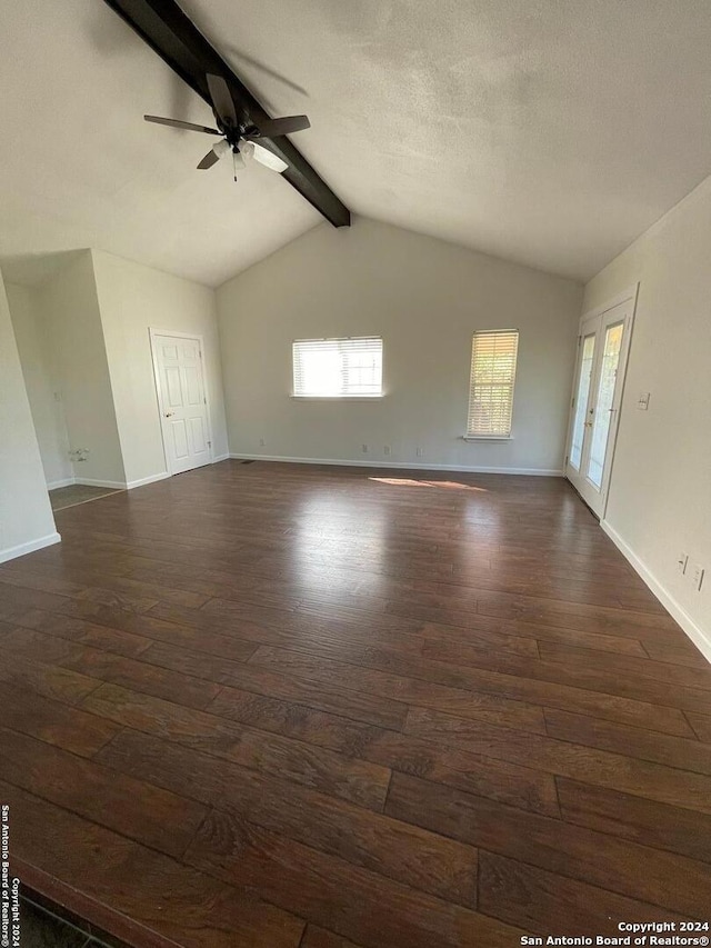 interior space featuring lofted ceiling with beams, ceiling fan, a textured ceiling, and dark hardwood / wood-style floors