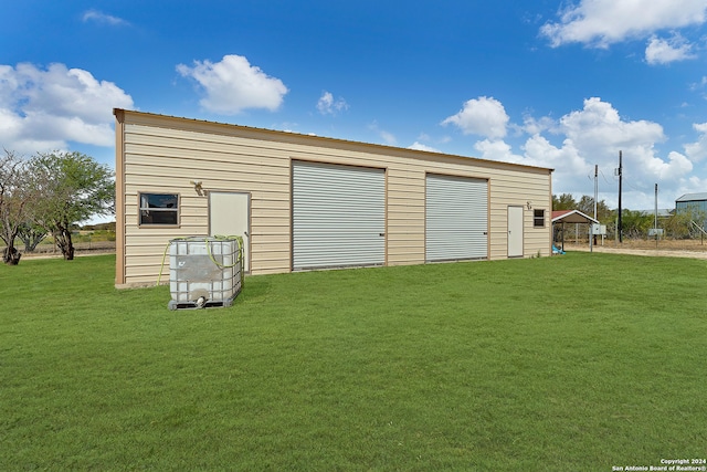 garage with a lawn