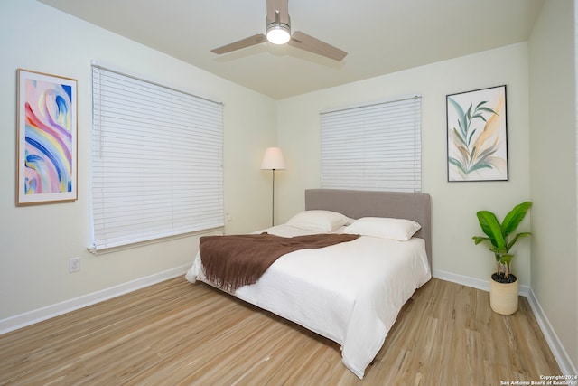 bedroom featuring hardwood / wood-style floors and ceiling fan