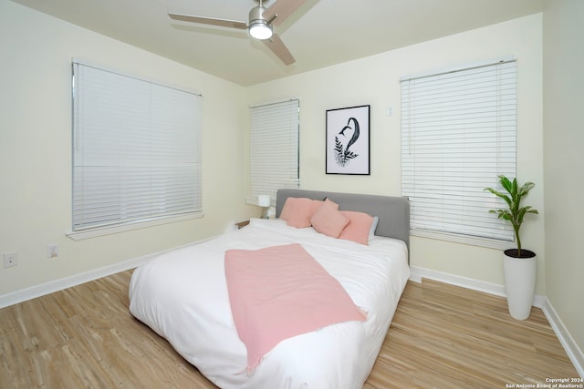 bedroom featuring ceiling fan and light hardwood / wood-style floors