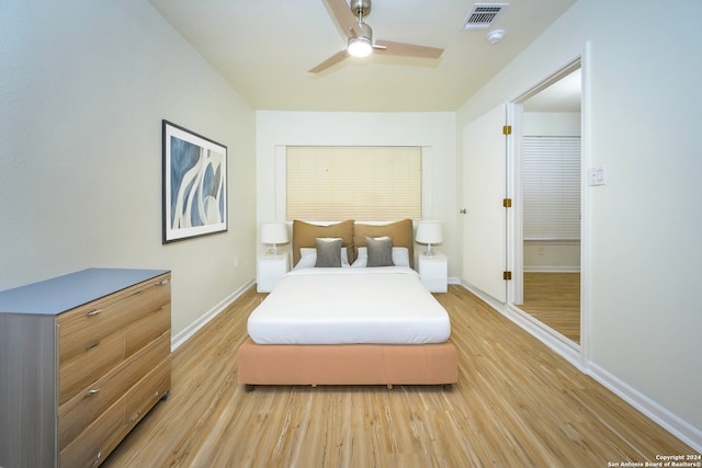 bedroom featuring light hardwood / wood-style floors and ceiling fan