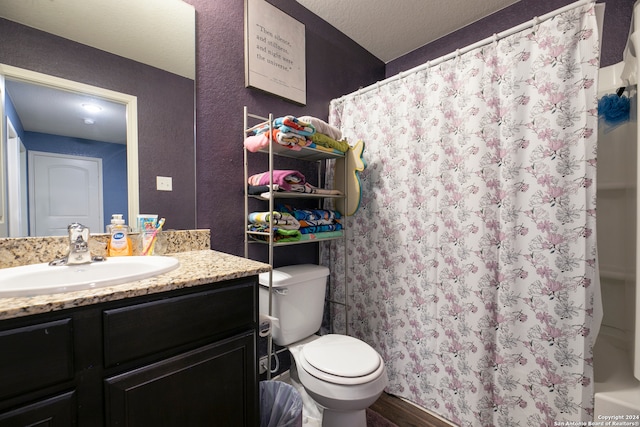 bathroom featuring toilet, curtained shower, a textured ceiling, hardwood / wood-style flooring, and vanity