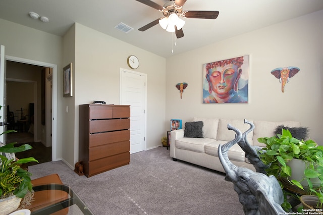 carpeted living room featuring ceiling fan