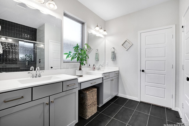 bathroom featuring tile patterned floors, vanity, and walk in shower