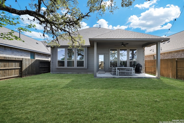 rear view of house with a lawn, a patio area, and ceiling fan