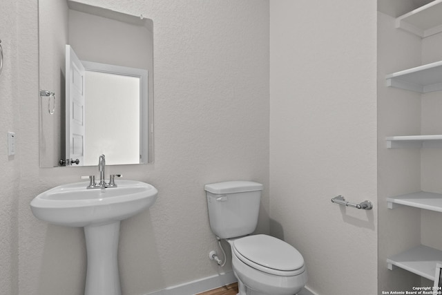 bathroom featuring toilet