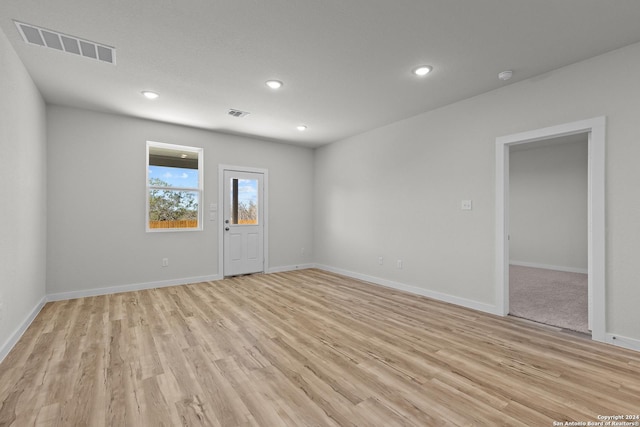 spare room with light wood-type flooring