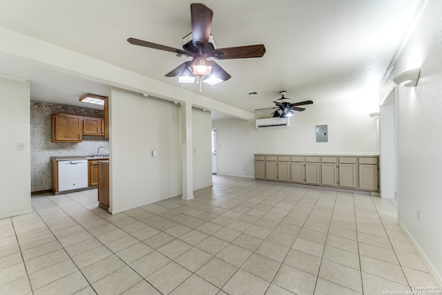 unfurnished living room featuring a wall mounted air conditioner, light tile patterned flooring, ceiling fan, and sink