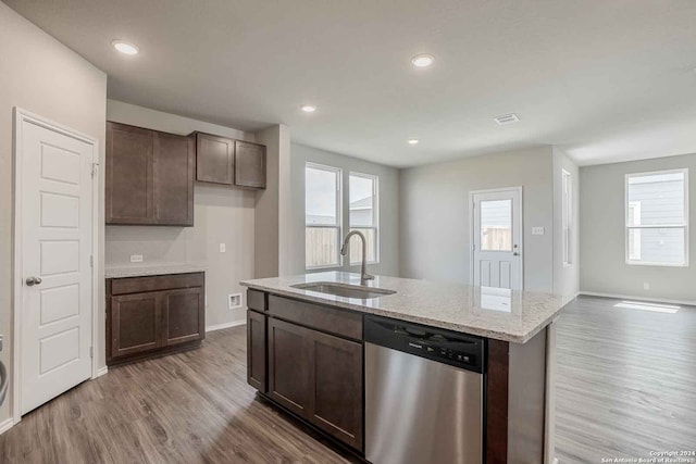 kitchen featuring hardwood / wood-style floors, stainless steel dishwasher, a wealth of natural light, and sink