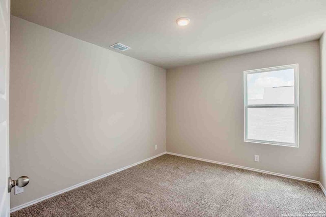 view of carpeted spare room