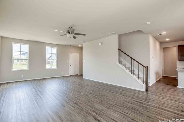 interior space with dark hardwood / wood-style flooring and ceiling fan