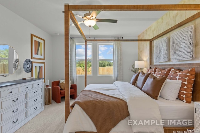 bedroom featuring ceiling fan and light carpet