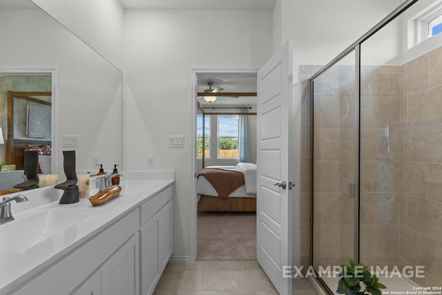 bathroom featuring tile patterned flooring, vanity, ceiling fan, and walk in shower