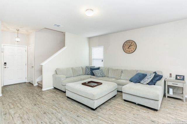 living room with light hardwood / wood-style flooring