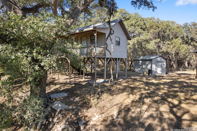 back of property with a shed