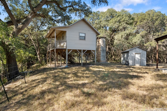 exterior space with a lawn and a storage unit