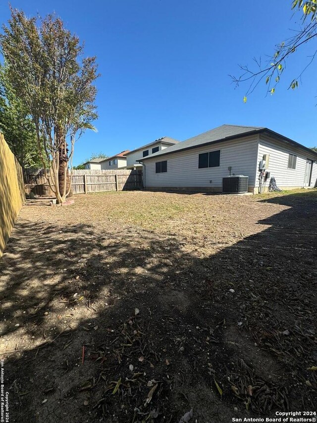 view of yard with central AC