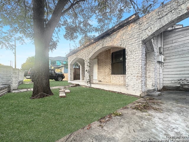 view of home's exterior featuring a lawn