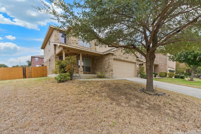 view of front of property with a front lawn and a garage